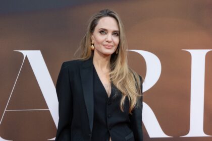 Angelina Jolie Puts a Festive Twist on the Holiday Suit