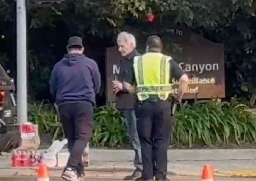 Harrison Ford gets escorted by police to check on his Brentwood home as fires rage across Los Angeles