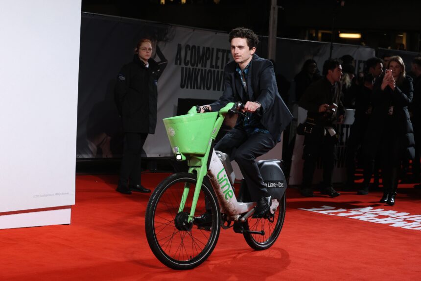 Timothée Chalamet Accessorizes His Premiere Outfit With a Lime Bike