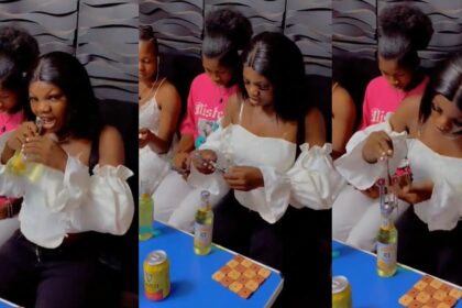 Lady strúggles with the bottle opener at a club, resorts to using her teeth (VIDEO)
