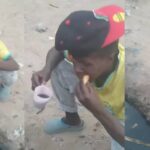 Man uses dirty drainage water to eat bread