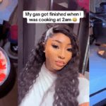 “Candlelight dinner no pass like this” – Lady resorts to using candles after her gas finished while she was cooking at 2 a.m (WATCH)