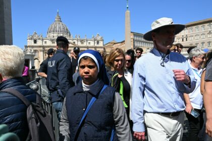 In Vatican City, mourners and the curious gather after Pope Francis dies