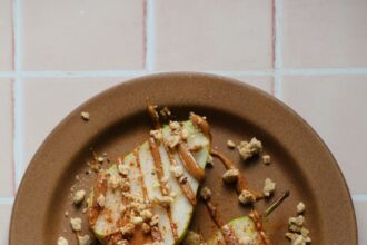 Dressed-Up Pear Slices With Almond Butter and Granola