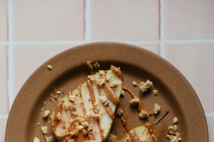 Dressed-Up Pear Slices With Almond Butter and Granola