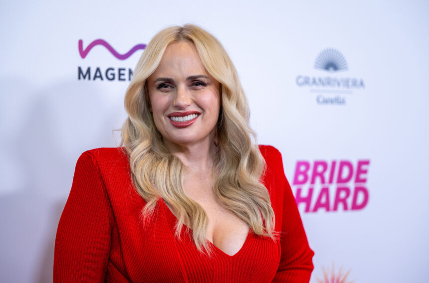 Rebel Wilson on Working With Robert Pattinson’s ‘Batman’ Stunt Coordinators on ‘Bride Hard’ And Wanting ‘Fat Amy’ to Get Married in ‘Pitch Perfect 4’